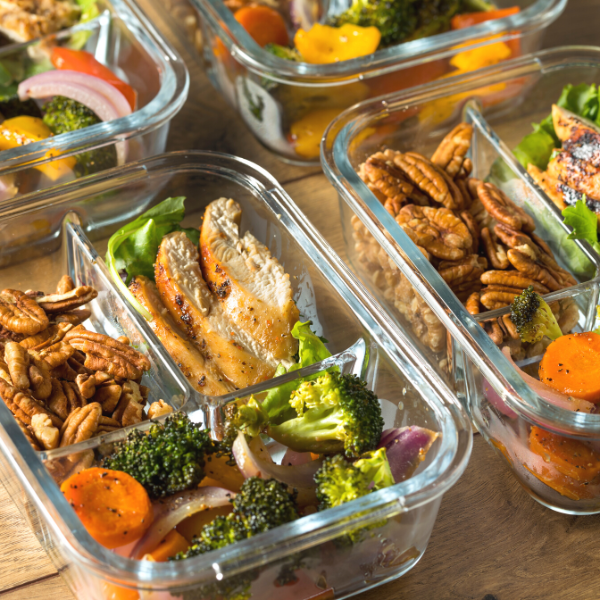 Homemade keto chicken meal prep with veggies in container.