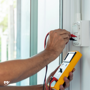 man checking electrical connections