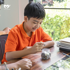 father and son teaching son to Financial Literacy save money