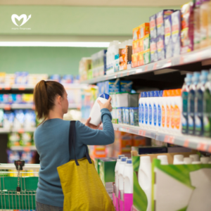 Female shopper in a supermarket aisle